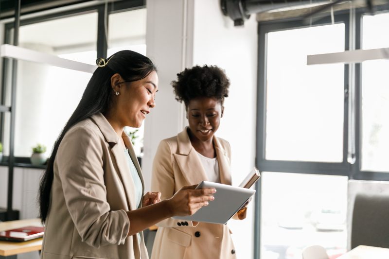 two women reviewing a report