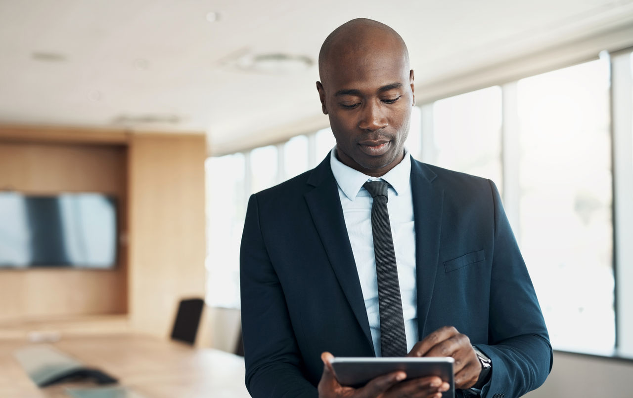 Working man with tablet in office setting
