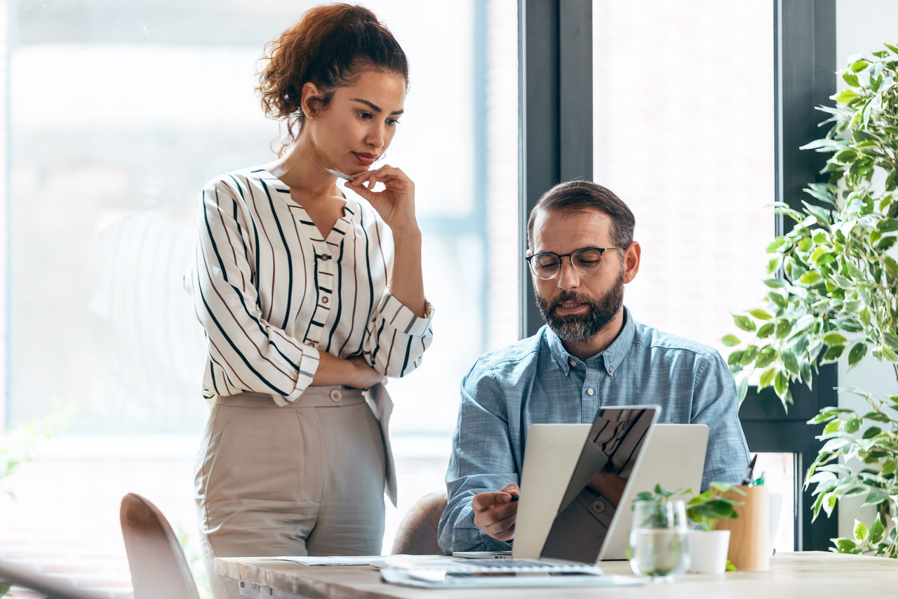Business people working together with laptop