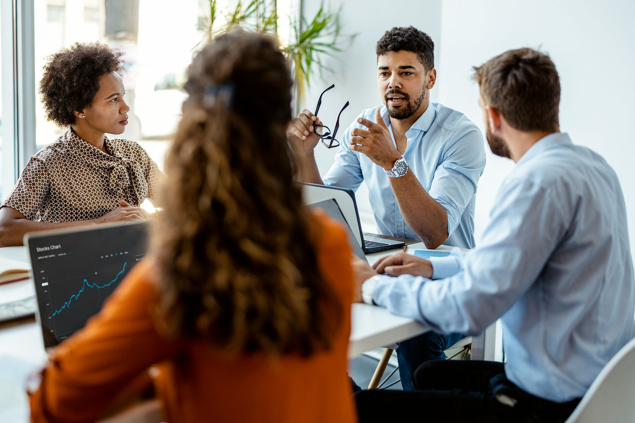 Group of young people discussing business